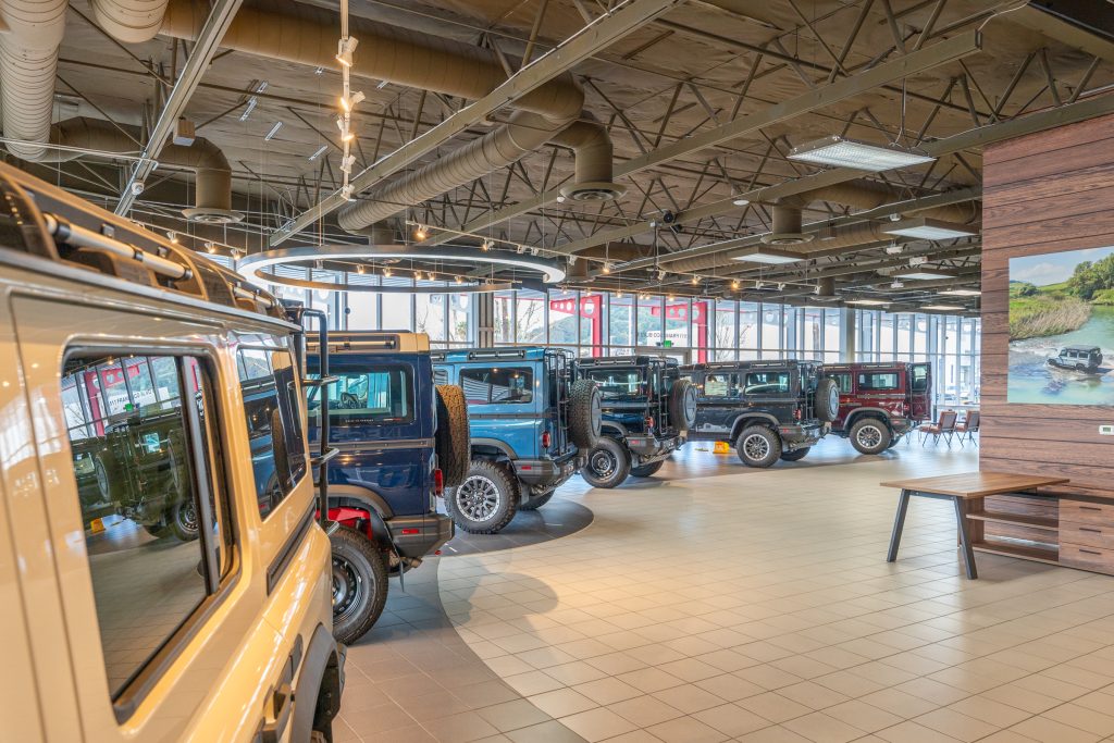 Row of cars in INEOS showroom